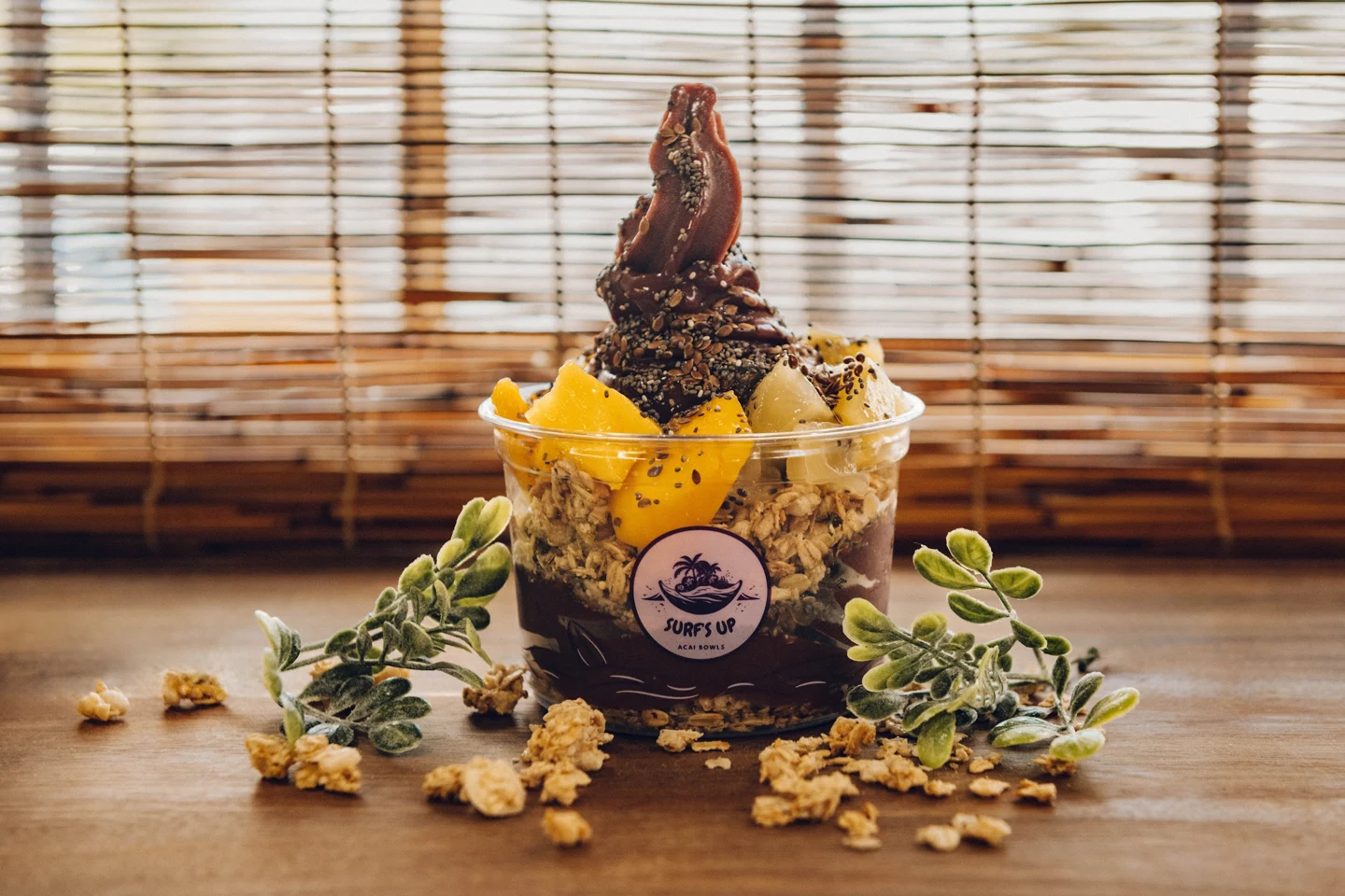 Açaí bowl topped with bright mango, pineapple and seeds